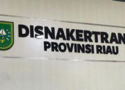 Foto : Tulisan dinding Disnakertrans Provinsi Riau.